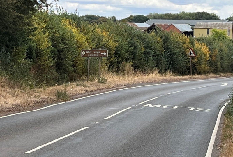 Look for the brown Whitlenge Gardens and right-turn signs